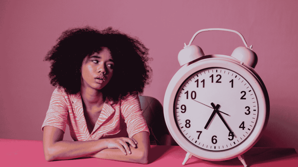 A woman watching the time before making big decisions, representing simple and intentional daily living choices